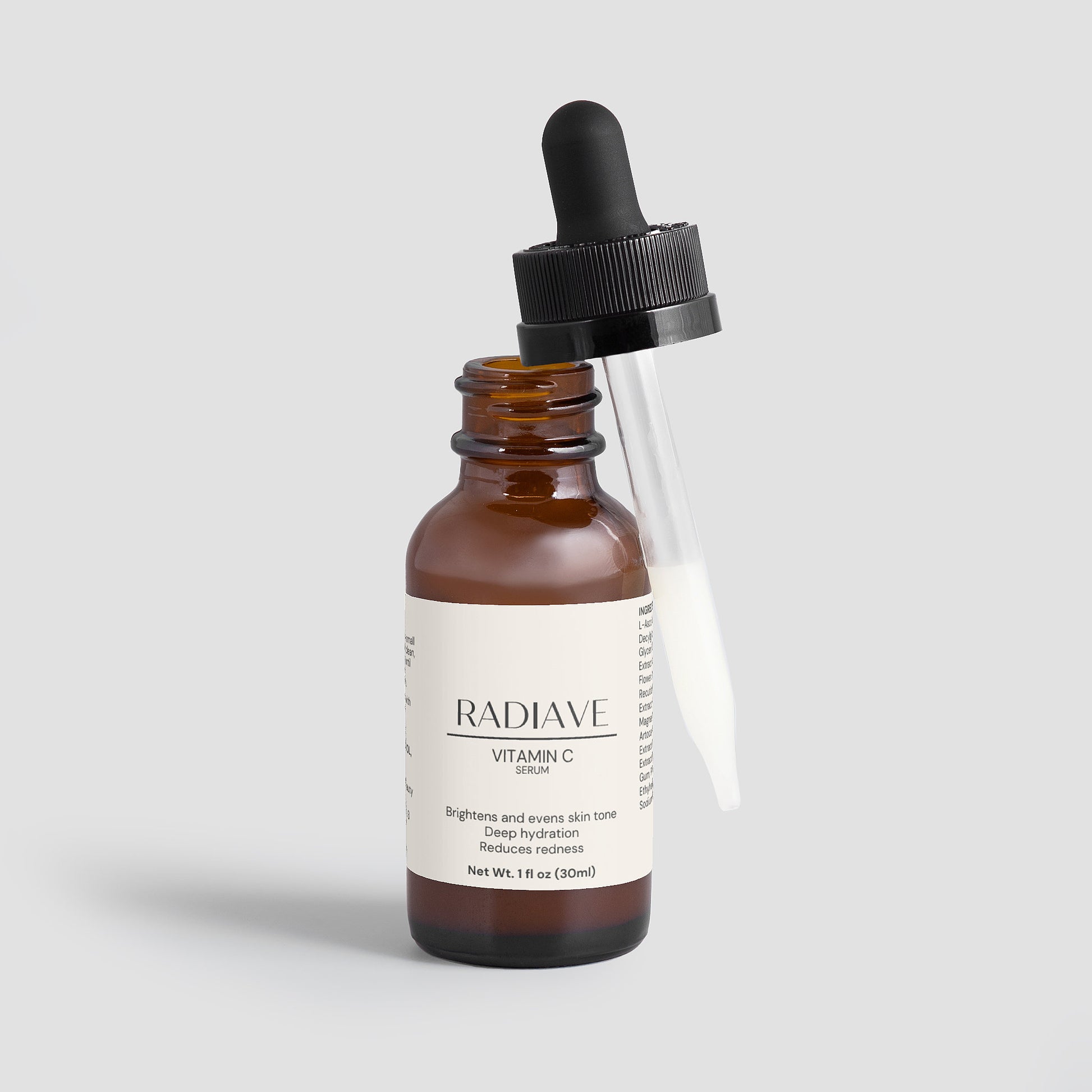 Brown serum bottle with dropper labeled 'Radiave' on a light gray background