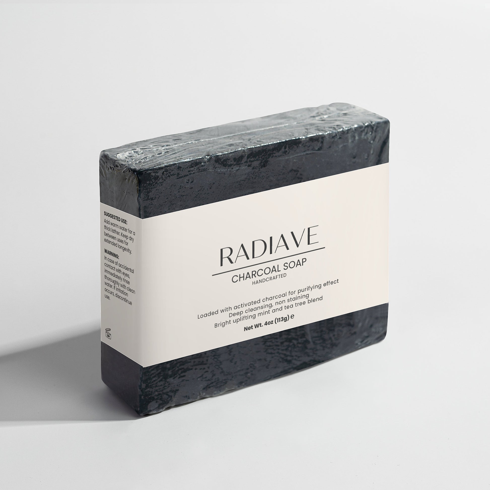 Radiave charcoal soap bar on a light gray background