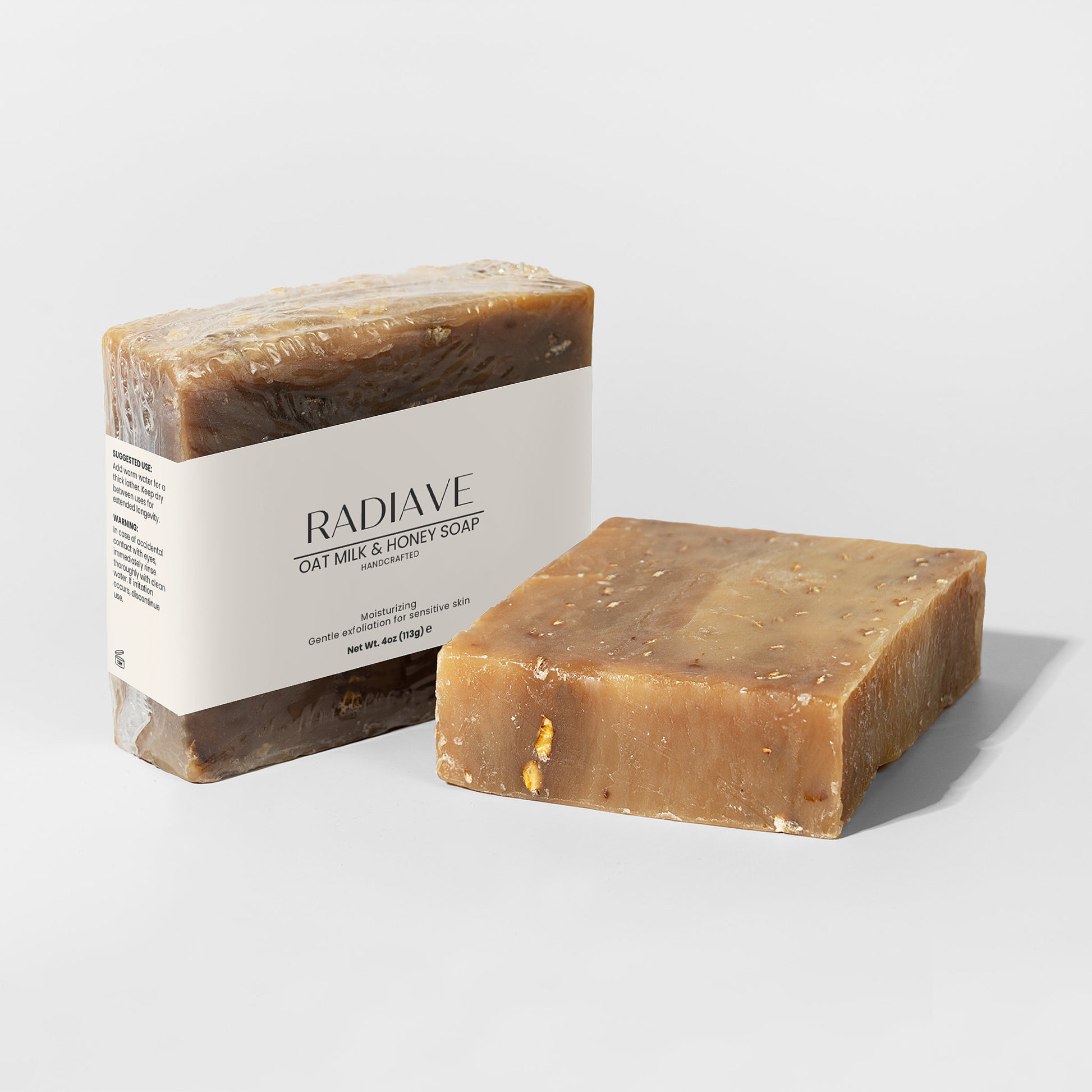 Two bars of Radiave soap on a light gray background
