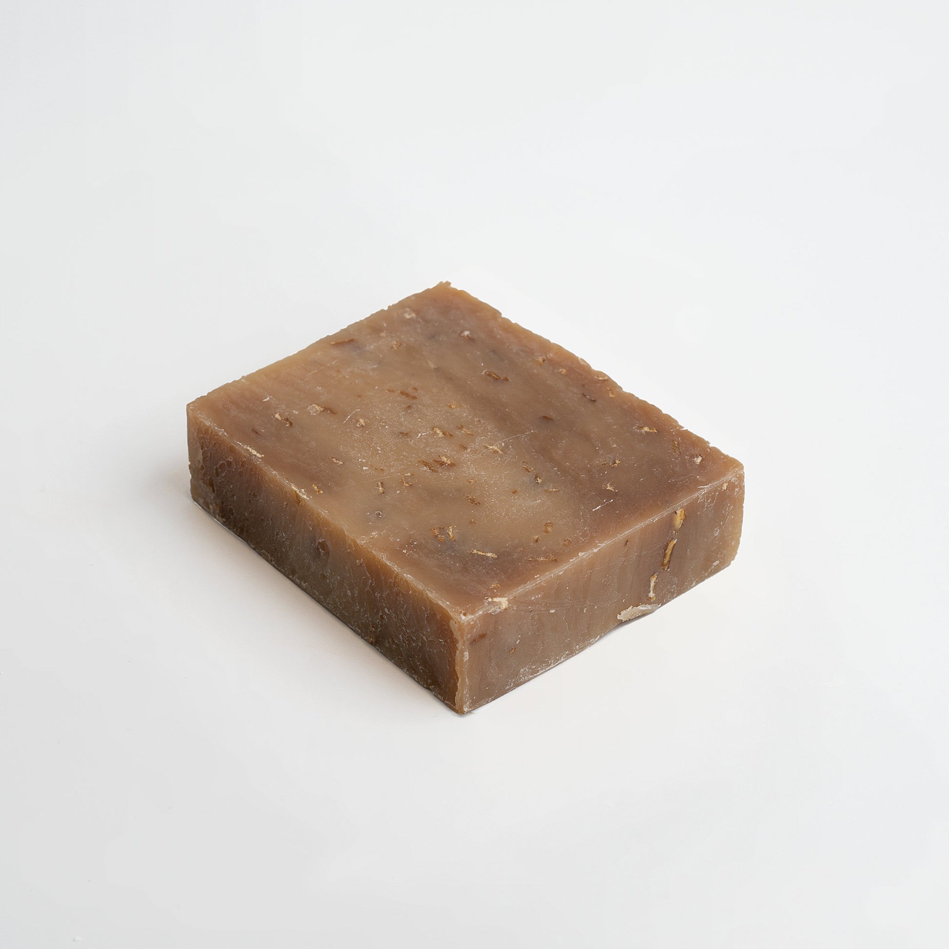 Bar of brown soap on a white background