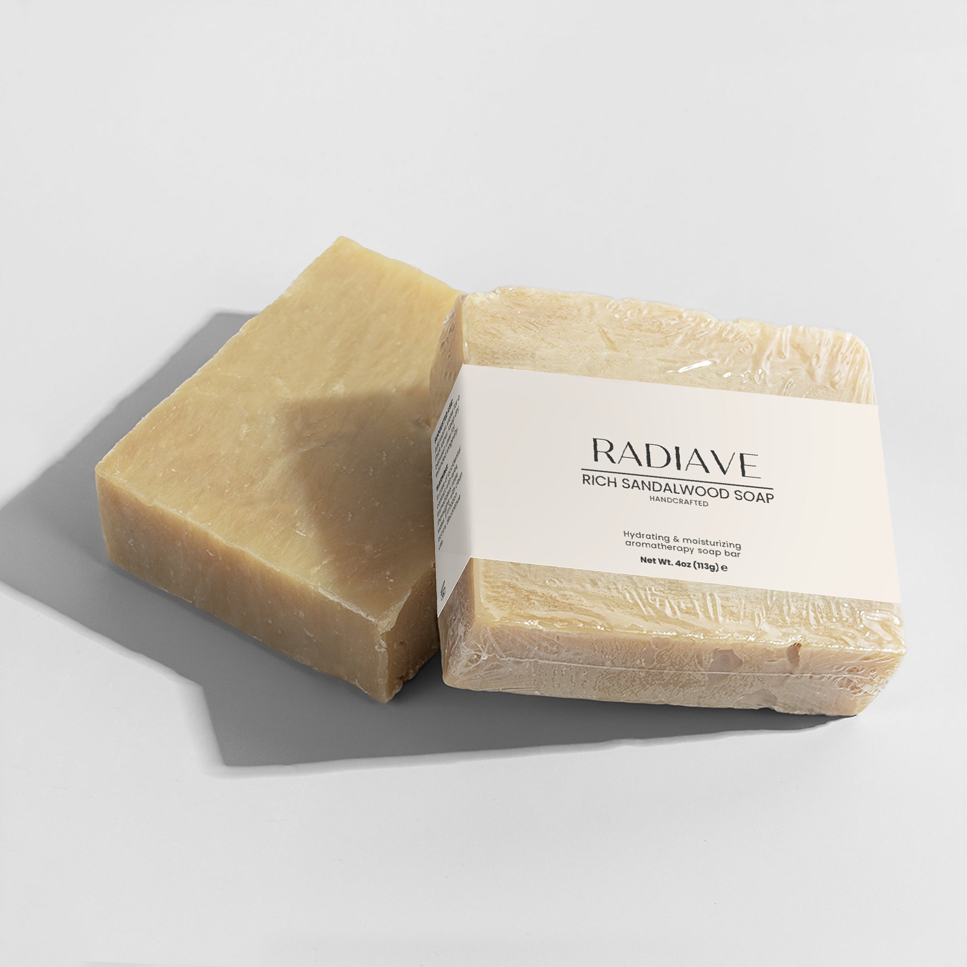 Radiave Rich Sandalwood Soap on a gray surface with a white background