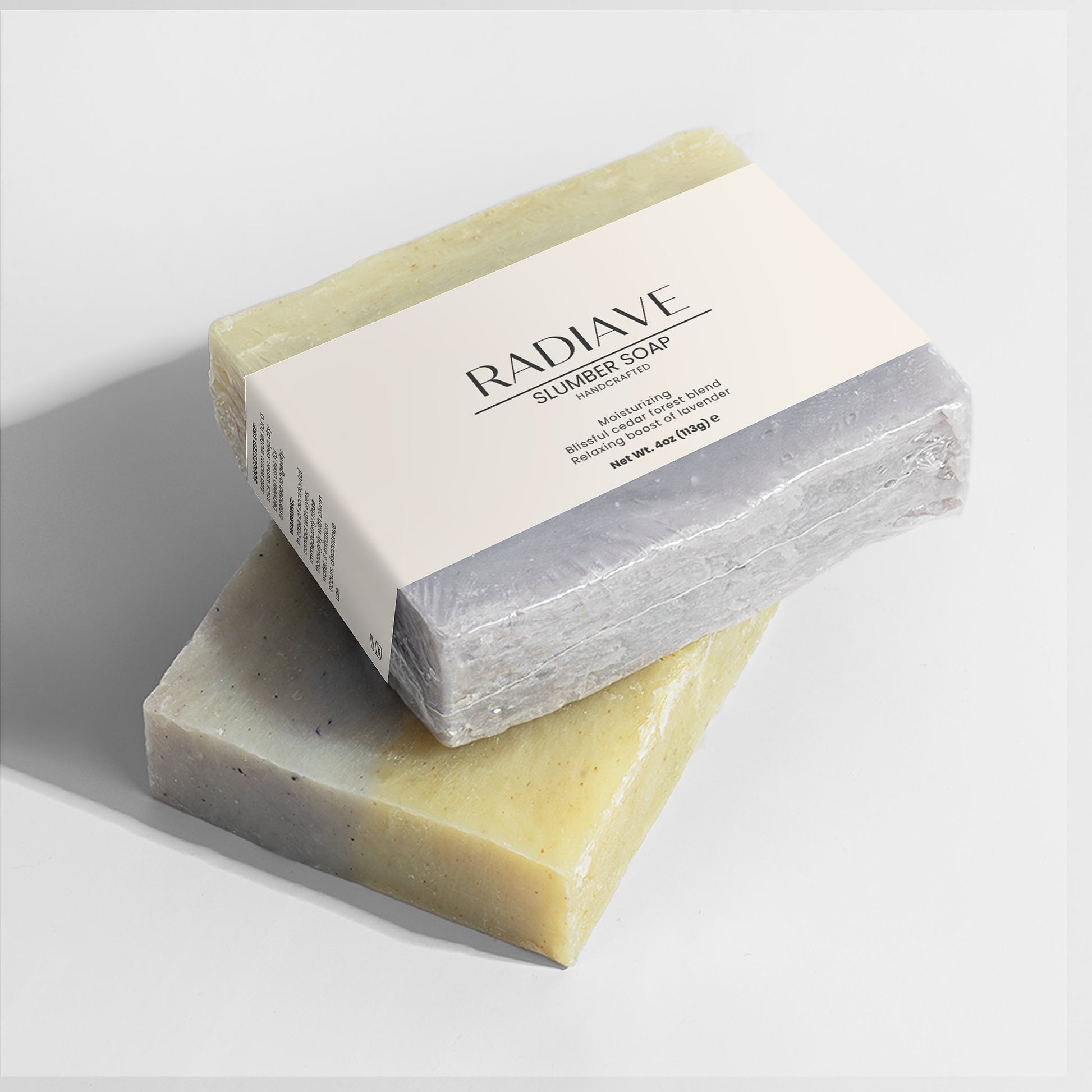 Two bars of soap with a box labeled 'Radiave' on a white background